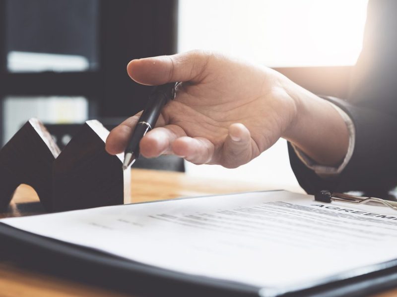 Businessman,Hand,And,Contract,Agreement,Paper,With,Customer,To,Sign