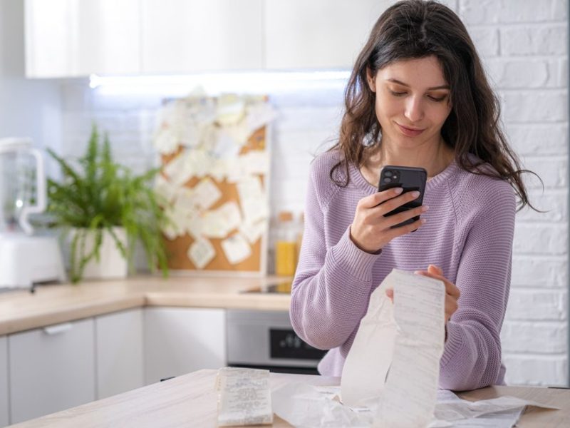 Economical,Woman,Work,On,Phone,Calculator,At,Home,Pay,Bills